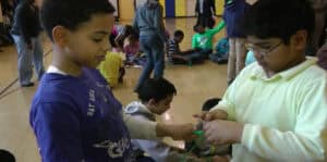 Children participating in a group activity at LoveOCOC event.
